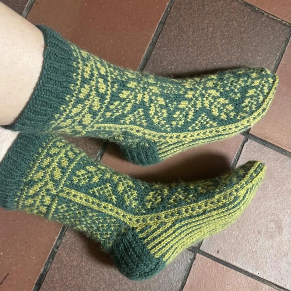 Elf Boots sock pattern Elf Boots knitted socks with leafy colourwork and a pointed toe